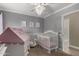 Alternate view of the Bedroom, featuring a crib, play tent, and elegant decor at 1311 W Ellis St, Mesa, AZ 85201