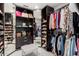Walk-in closet with custom shelving and ample storage for clothing and accessories at 1311 W Ellis St, Mesa, AZ 85201