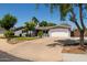 Well-maintained single-story home featuring a wide driveway and charming curb appeal at 1311 W Ellis St, Mesa, AZ 85201
