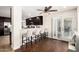Kitchen includes bar seating, dark wood cabinets, granite countertops, and stainless steel appliances at 1311 W Ellis St, Mesa, AZ 85201