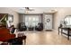 Beautifully appointed living room with tile flooring, piano, and an abundance of natural light at 1311 W Ellis St, Mesa, AZ 85201