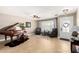Elegant living room featuring tile flooring, a piano, and comfortable seating area at 1311 W Ellis St, Mesa, AZ 85201