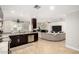 Open floor plan reveals the kitchen flowing seamlessly into the living room with fireplace at 1311 W Ellis St, Mesa, AZ 85201