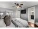 This bedroom features a king bed, ceiling fan, and ensuite bathroom at 1311 W Ellis St, Mesa, AZ 85201