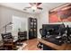 Bright home office with hardwood floors, ceiling fan, modern furniture, and a large desert-themed art piece at 1311 W Ellis St, Mesa, AZ 85201