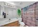 Bathroom with wood-look cabinet and vibrant greenery at 13219 N 26Th Ave, Phoenix, AZ 85029