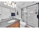 Bathroom featuring a glass enclosed shower, tile surround, and vanity at 13219 N 26Th Ave, Phoenix, AZ 85029