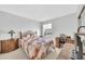 Cozy bedroom featuring a patchwork quilt, desk area, and neutral walls at 13219 N 26Th Ave, Phoenix, AZ 85029