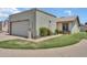 Home exterior featuring a detached garage, xeriscaping, and a well-maintained lawn at 13219 N 26Th Ave, Phoenix, AZ 85029