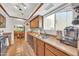 Kitchen featuring stainless steel sink, ample cabinets, tile floors, and natural light at 13219 N 26Th Ave, Phoenix, AZ 85029