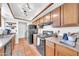 Well-equipped kitchen with black appliances, wood cabinets, and tile flooring at 13219 N 26Th Ave, Phoenix, AZ 85029