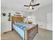 Bedroom featuring a dark wood bed frame, ceiling fan, and neutral carpet at 13219 N 26Th Ave, Phoenix, AZ 85029