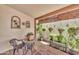 Picturesque patio featuring hanging and potted plants with a mosaic table at 13219 N 26Th Ave, Phoenix, AZ 85029