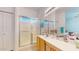 Bathroom featuring a glass-enclosed shower and a vanity with modern fixtures at 16537 N Oachs Dr, Surprise, AZ 85374