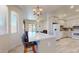 Open-concept kitchen and living area overlooking the backyard pool at 16537 N Oachs Dr, Surprise, AZ 85374