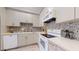 Bright kitchen features modern appliances, stylish backsplash, and lots of cabinet space at 16537 N Oachs Dr, Surprise, AZ 85374