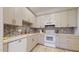 Modern kitchen featuring updated appliances, stylish backsplash, and ample counter space for meal preparation at 16537 N Oachs Dr, Surprise, AZ 85374