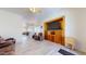 Bright living room with open layout, built-in entertainment center, and views of the kitchen and patio at 16537 N Oachs Dr, Surprise, AZ 85374