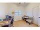Functional office area with desk, chair, and window for natural light at 16537 N Oachs Dr, Surprise, AZ 85374