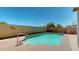 Backyard featuring a private in-ground pool, perfect for relaxing and entertaining outdoors at 16537 N Oachs Dr, Surprise, AZ 85374