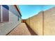 Side yard featuring gravel landscaping and a fence at 16537 N Oachs Dr, Surprise, AZ 85374