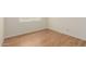 Bedroom with light wood flooring, bright walls, and a window at 1825 W Ray Rd # 1070, Chandler, AZ 85224