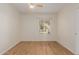 Bright bedroom with modern ceiling fan, wood-look flooring, and a large window letting in natural light at 1825 W Ray Rd # 1070, Chandler, AZ 85224