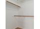 Walk-in closet featuring neutral paint and wood shelves for easy organization at 1825 W Ray Rd # 1070, Chandler, AZ 85224