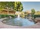 Charming water fountain surrounded by lush greenery and rock features, adding a serene touch to the community at 1825 W Ray Rd # 1070, Chandler, AZ 85224