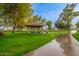 Community gazebo with a picnic table, surrounded by trees and green space at 1825 W Ray Rd # 1070, Chandler, AZ 85224