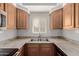 Close-up of the kitchen's countertops, stainless steel sink, and subway tile backsplash at 1825 W Ray Rd # 1070, Chandler, AZ 85224