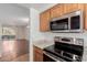 Modern kitchen with stainless appliances and view to the living area at 1825 W Ray Rd # 1070, Chandler, AZ 85224