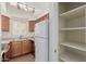 Functional kitchen with ample cabinet space, a pantry, and stainless steel appliances at 1825 W Ray Rd # 1070, Chandler, AZ 85224