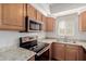 Well-equipped kitchen featuring stainless steel appliances and granite countertops at 1825 W Ray Rd # 1070, Chandler, AZ 85224
