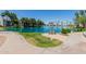 Scenic view of a serene lake with palm trees and greenery, creating a tranquil atmosphere at 1825 W Ray Rd # 1070, Chandler, AZ 85224