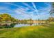 Lovely lake with surrounding green spaces and trees, creating a peaceful and scenic community atmosphere at 1825 W Ray Rd # 1070, Chandler, AZ 85224