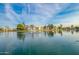 Water fountain in the middle of a calm lake, reflecting surrounding condos in a peaceful community at 1825 W Ray Rd # 1070, Chandler, AZ 85224