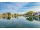 Expansive lake view reflecting the surrounding community, showcasing a serene and inviting neighborhood at 1825 W Ray Rd # 1070, Chandler, AZ 85224