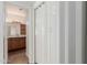 View of laundry room featuring accordion door and bathroom in background at 1825 W Ray Rd # 1070, Chandler, AZ 85224