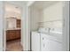 Laundry room featuring new washer and dryer machines and bathroom in background at 1825 W Ray Rd # 1070, Chandler, AZ 85224