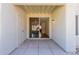 Exterior patio with sliding glass door, tan stucco wall, and concrete tile at 1825 W Ray Rd # 1070, Chandler, AZ 85224