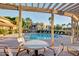 Relaxing pool area featuring a covered patio, comfortable seating, and a pristine pool for residents to enjoy at 1825 W Ray Rd # 1070, Chandler, AZ 85224