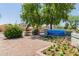 Landscaped sign reading 'Lakeshore at Anderson Springs Condominiums' surrounded by colorful flowers and lush greenery at 1825 W Ray Rd # 1070, Chandler, AZ 85224