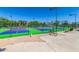 Outdoor tennis and pickleball courts, with green turf and blue playing surfaces at 1825 W Ray Rd # 1070, Chandler, AZ 85224