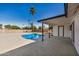A backyard with a refreshing blue swimming pool with covered patio at 1906 N Evergreen St, Chandler, AZ 85225