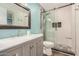 Updated bathroom with modern vanity, decorative tile accents, and frameless shower at 1906 N Evergreen St, Chandler, AZ 85225