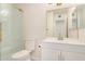 Bathroom with white vanity, frameless shower, and modern fixtures at 1906 N Evergreen St, Chandler, AZ 85225