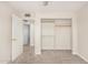 Bedroom featuring an open closet, carpet and a doorway to an adjoining room at 1906 N Evergreen St, Chandler, AZ 85225