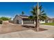 Angle side view of a single-story home featuring a two-car garage and solar panels at 1906 N Evergreen St, Chandler, AZ 85225