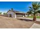 Angle side view of a single-story home featuring a two-car garage and solar panels at 1906 N Evergreen St, Chandler, AZ 85225